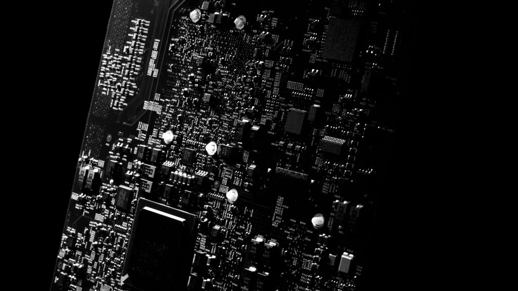 Annotated teardown photo of a Wii console internals on a workbench mat