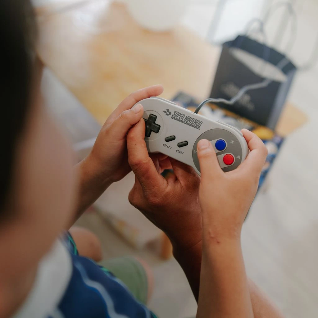 Annotated photograph of a removed Wii laser lens assembly